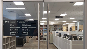 Rows of books on shelves of our library. Shows one way we give everyone access information.