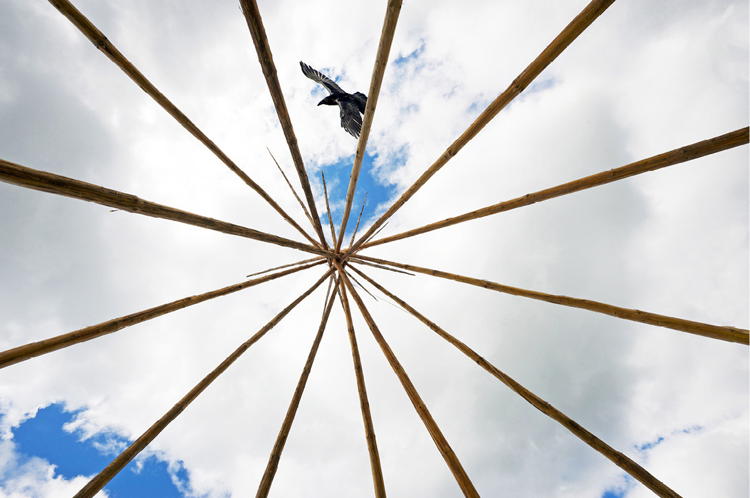 Traditional native teepee frame, bottom up view, wide angle.