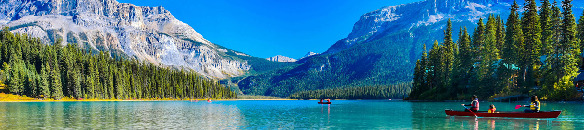 People canoeing on an alpine lake