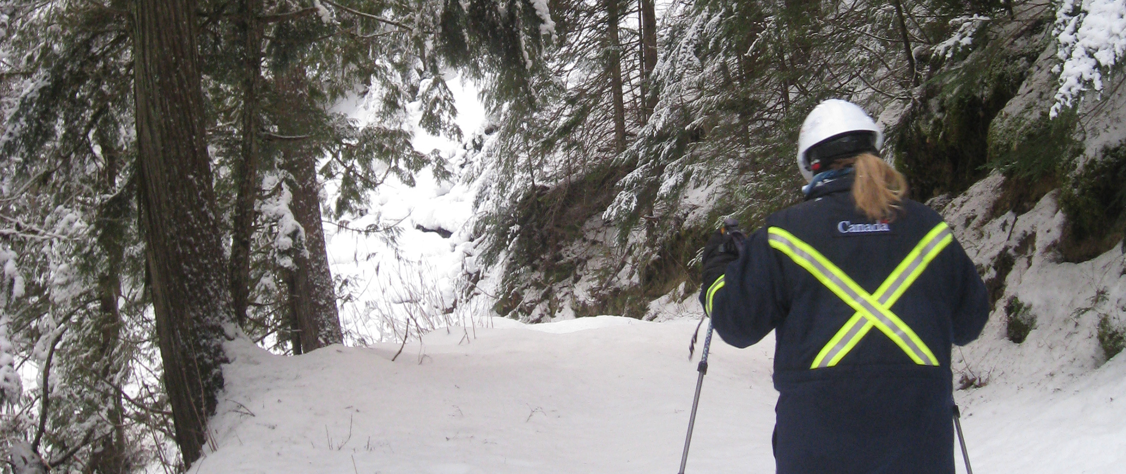 NEB Inspector walking a snowy right-of-way