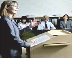 Woman speaks at podium