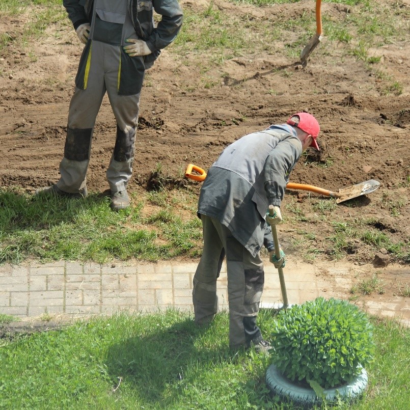 Figure 3 – Crew repairing a walkway and surrounding landscaping.