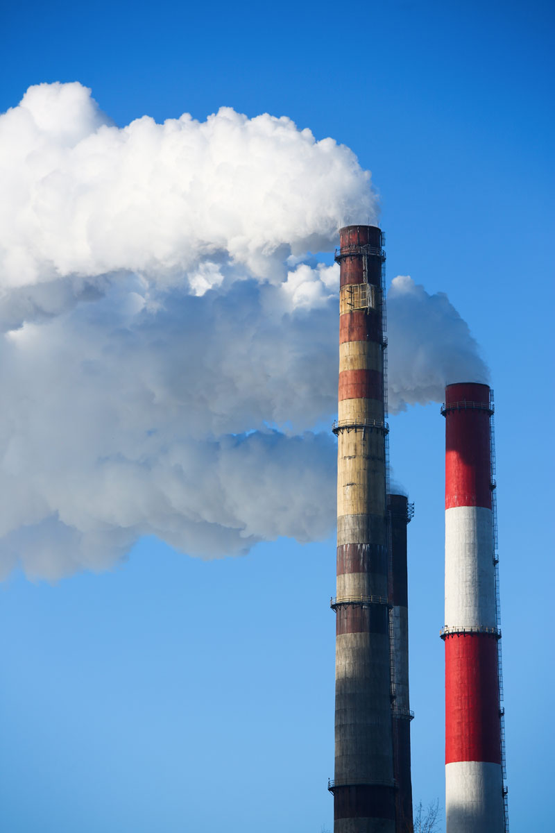 Three smoking chimneys.