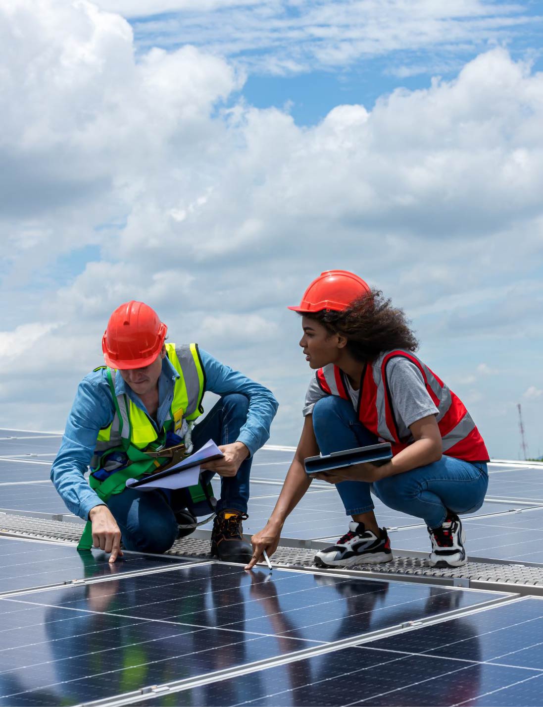 Engineers inspect solar panels.