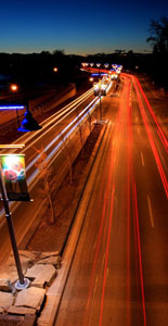 Memorial Drive in Calgary, at nighttime, with a slow shutter speed effect that traces the lights from traffic