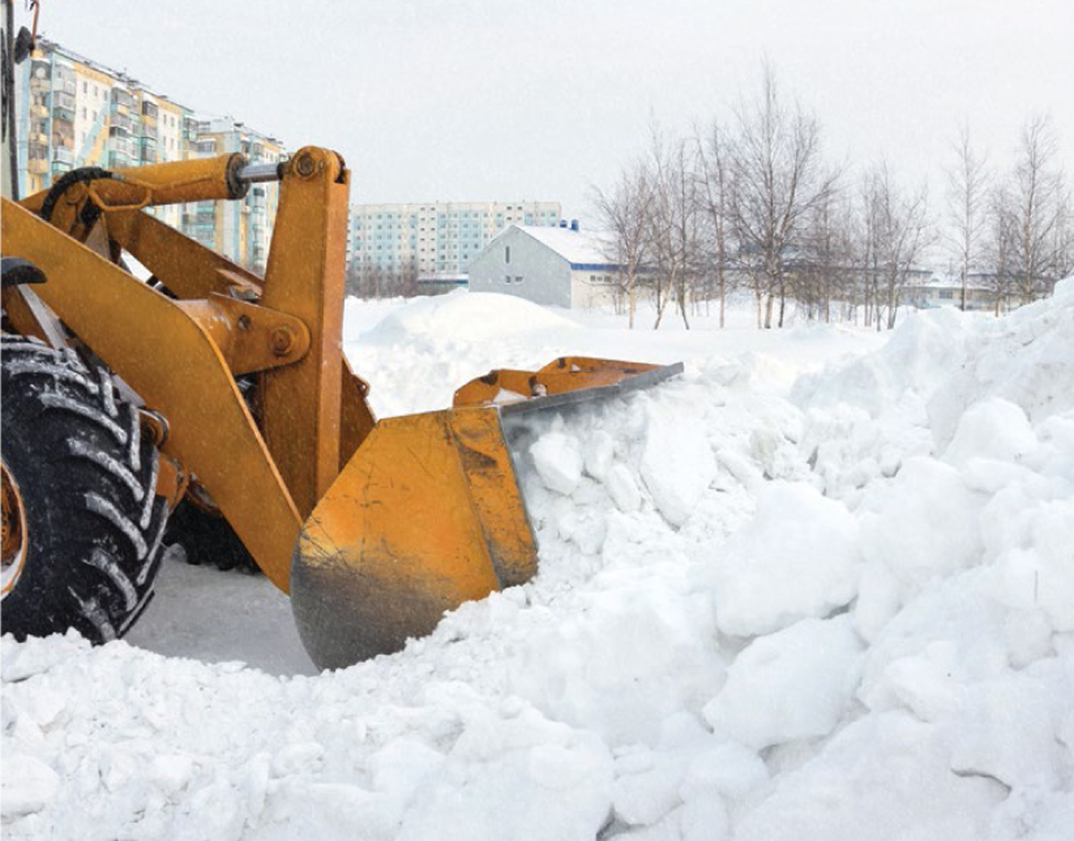 Front end loader clearing snow